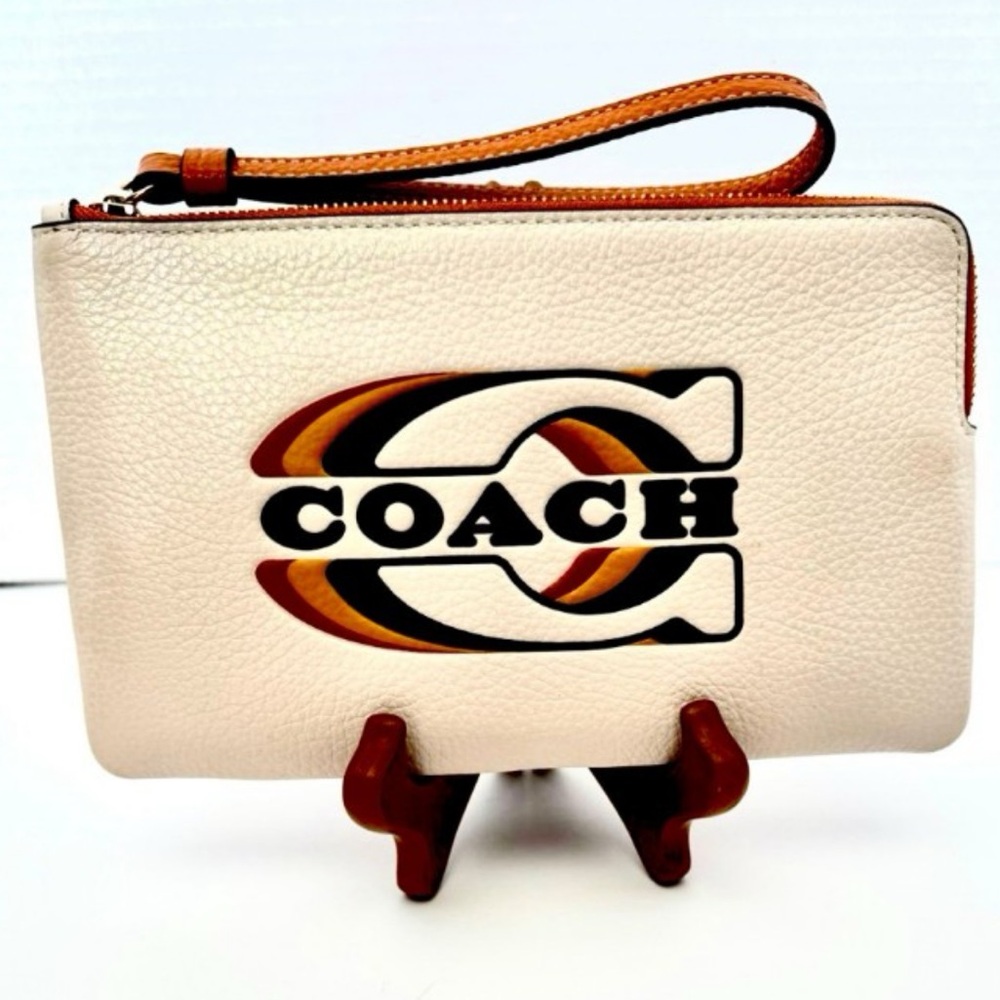 Coach Tan and Cream Textured Pebbled Leather Wristlet. NWOT.